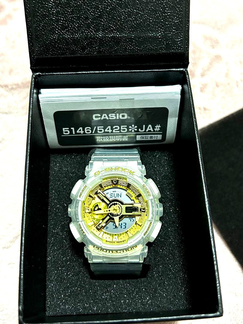 Casio G-Shock GMA-S110SG-7A gold and white unisex quartz watch with case and manual