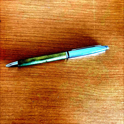 Old vintage-style Cross ballpoint pen with a classic design and metallic finish