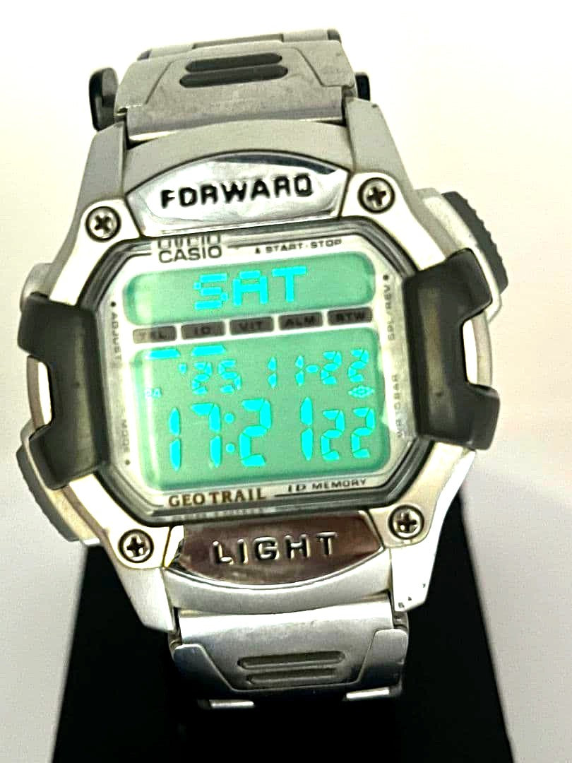 Vintage Casio GEO TRAIL digital watch with metal band showing digital display and metal bracelet