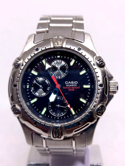Casio Quartz Watch Model MTD-1015 with black dial and stainless steel band showing water resistance 100m
