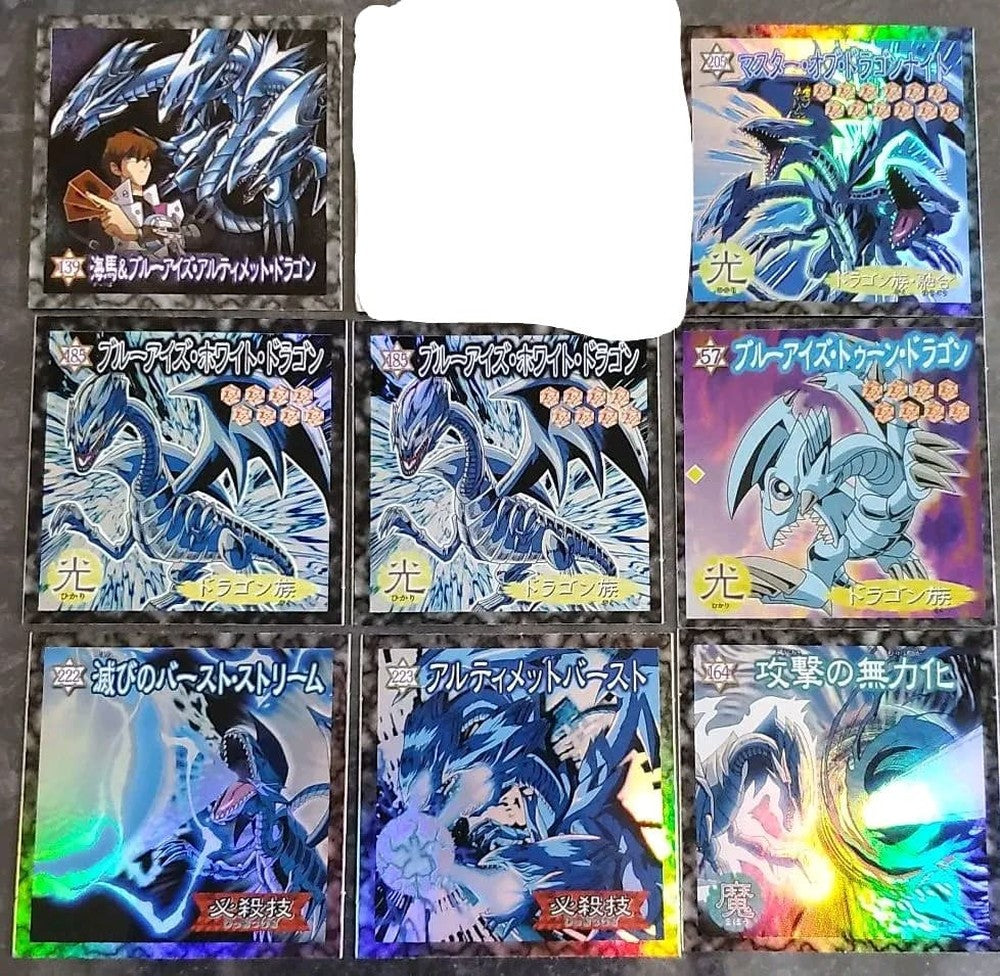 Morinaga Yugi-Oh Blue-Eyes White Dragon sticker with visible peeling damage from Kaiba set