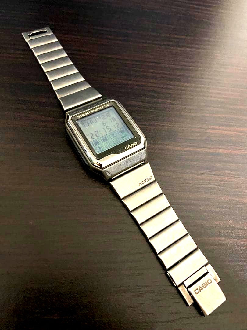 Casio Data Bank VDB-2000 HOTBIZ tarnished silver vintage Japanese electronic dictionary wristwatch with backlight