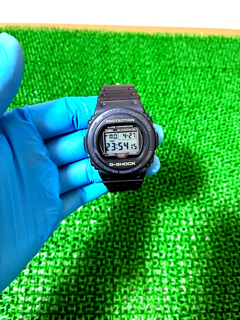 Casio G-Shock DW-5700 used watch showing front face with visible scratches