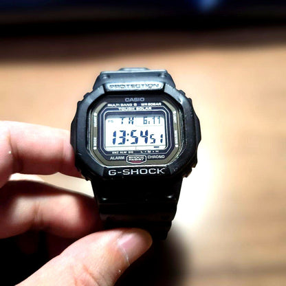 Casio G-Shock GW-5000U watch body showing black bezel and strap with visible minor scratches