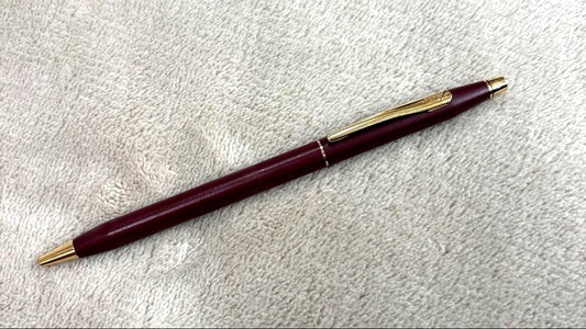CROSS Classic Century Ballpoint Pen in burgundy with gold trim featuring a twist mechanism and conical tip