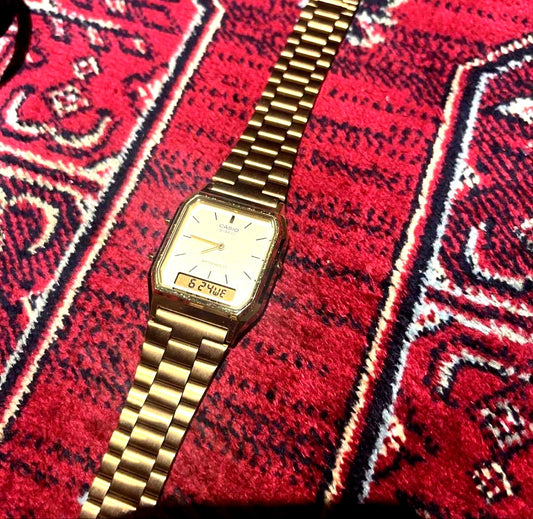 Casio AQ-230 gold watch with gold dial and band in excellent used condition