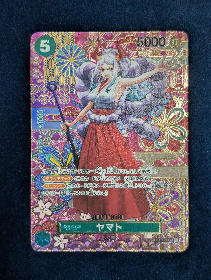 One Piece Card Game Yamato SP OP01-121 Parallel card with faint line scratch on back, shown in protective sleeve