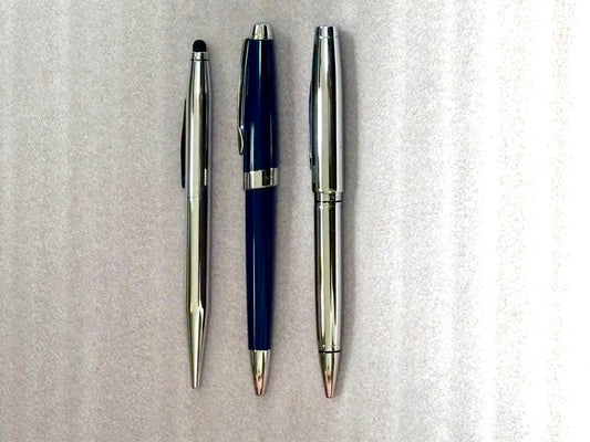 Cross ballpoint pen set of three featuring one blue resin pen and two silver metal pens with cases
