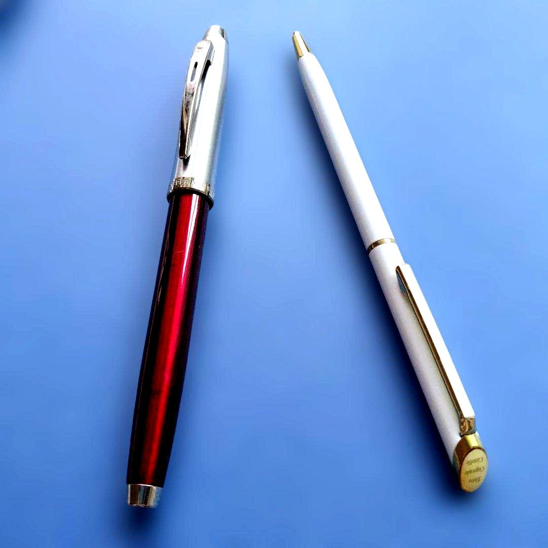 Sheaffer 100 Year fountain pen with red body, silver hairline stainless steel cap, white dot clip, and F nib