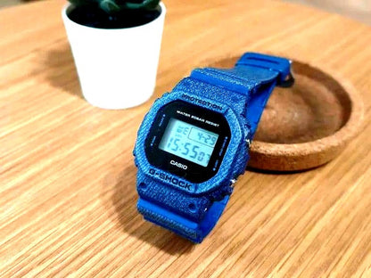 Casio G-Shock DW-5600DE-2JF denim blue digital watch with shock-resistant design