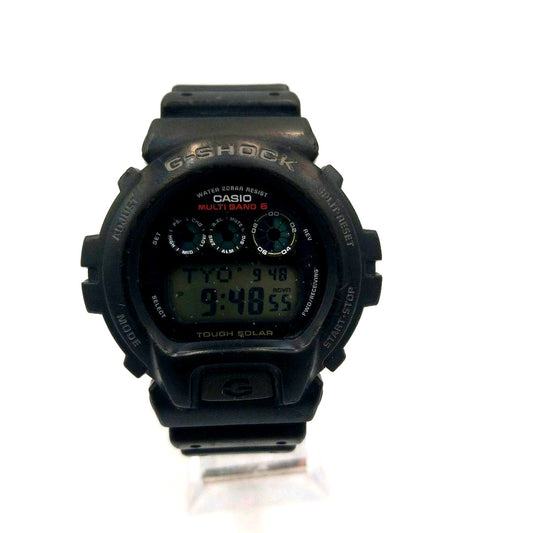 Casio G-Shock GW-6900 black solar digital watch with radio sync and black band on white background