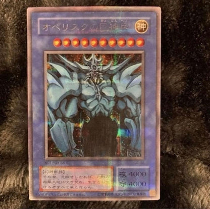 Yugioh OCG Obelisk the Tormentor collectible card with visible Signs of surface wear and edge chips