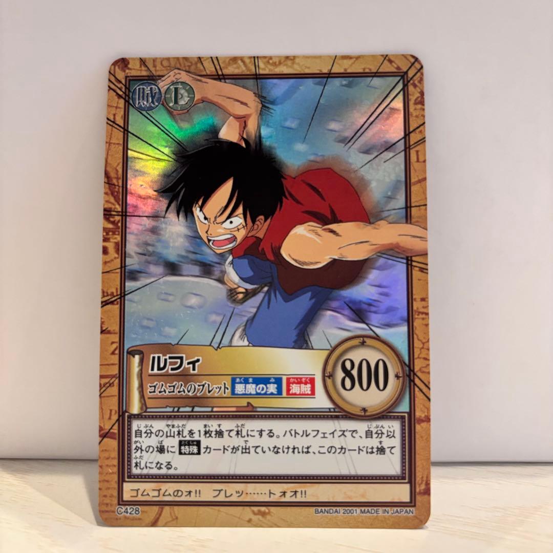 One Piece Hyper Battle Card C428 featuring Luffy Rubber Rubber Bullet from 2001 in protective sleeve