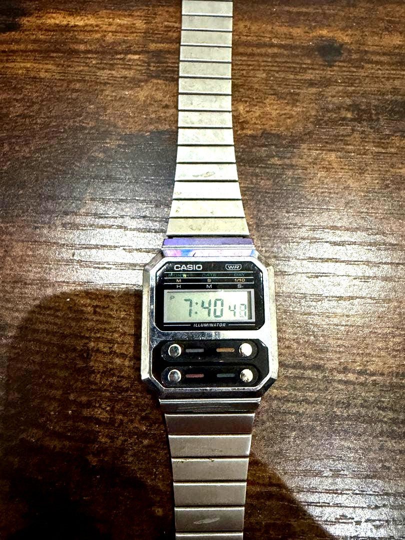 Casio digital wristwatch in silver with slight visible wear but fully functional