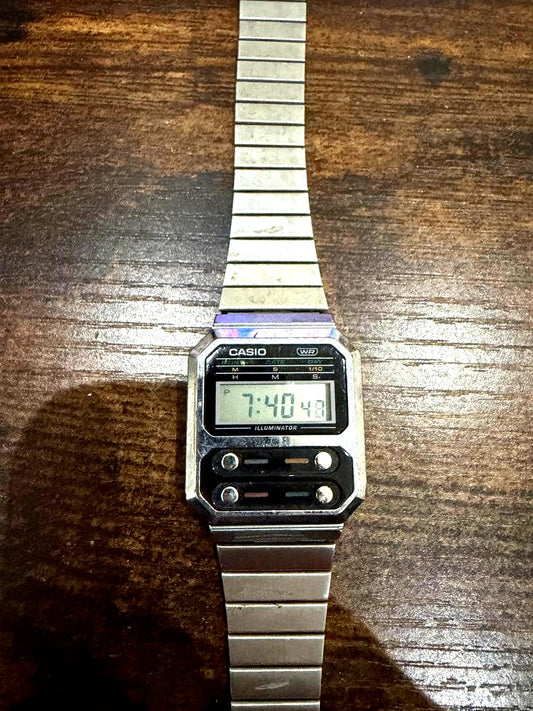 Casio digital wristwatch in silver with slight visible wear but fully functional