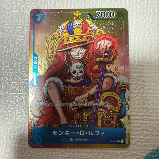 One Piece Monkey D. Luffy P-043 game card featuring character artwork from the One Piece series