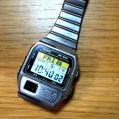 Casio Vintage Digital Watch Model BP-300 in silver with visible scratches and aged condition