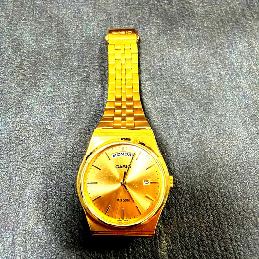 Casio MTP-B146G-9AV gold quartz wristwatch with date display, Japan import, photographed on white background