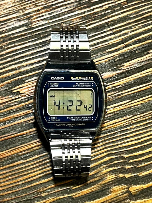 Casio 79QS-39 UC vintage digital watch showing scratches on glass and digital face with retro design