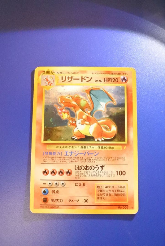 Vintage Japanese Pokemon Card Charizard LV 76 No 006 Energy Burn with visible wear and white spots