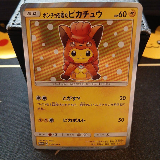 Bandai Pokémon Card Game single card featuring Pikachu in poncho and Vulpix from the Pokémon series