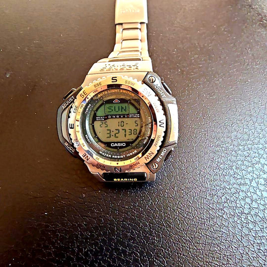 Used Casio Pro Trek men's wristwatch with visible scratches and dirt on band and case