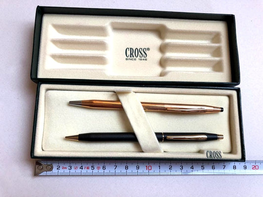 Cross gold metal ballpoint pen paired with black metal mechanical pencil set