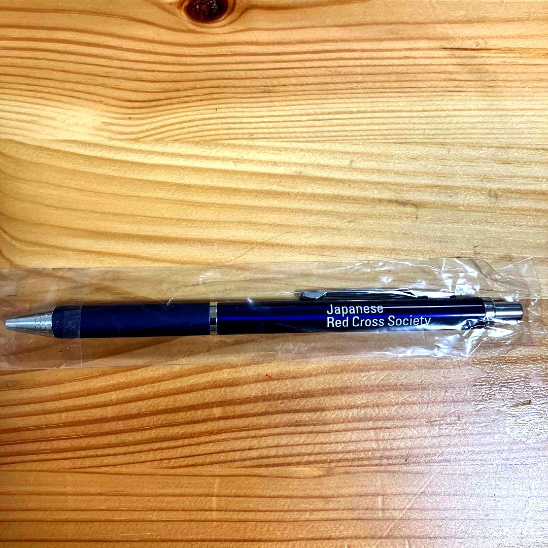 Navy blue Japanese Red Cross Society ballpoint pen with click mechanism and logo printed on barrel