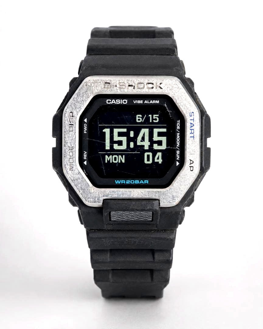 Casio G-Shock G-Lide GBX-100 Bluetooth digital watch with MIP LCD screen showing time and date