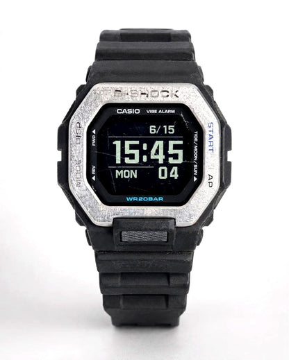 Casio G-Shock G-Lide GBX-100 Bluetooth digital watch with MIP LCD screen showing time and date