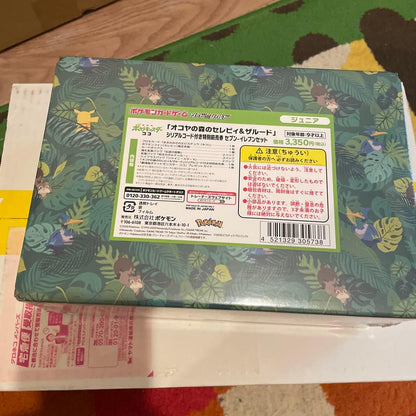 Bandai Pokemon Okoaya Forest Celebi & Zarude 7-Eleven set featuring promo cards, coins, booster packs, and serial code ticket