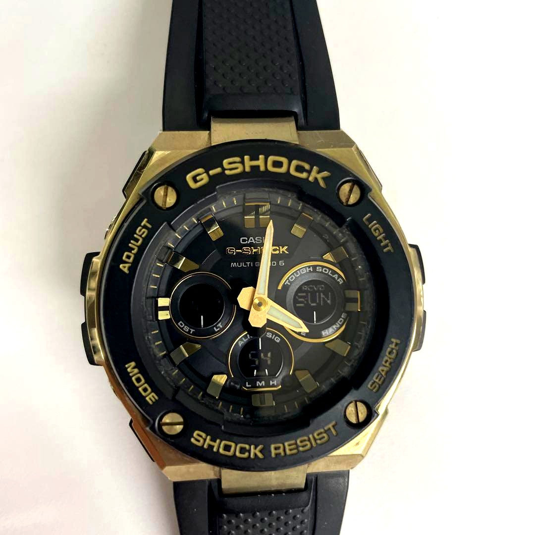 Casio G-Shock GST-W300G radio solar watch with black and gold design showing the face and band