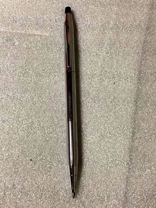 Cross brand sleek black pen with silver accents on a white background