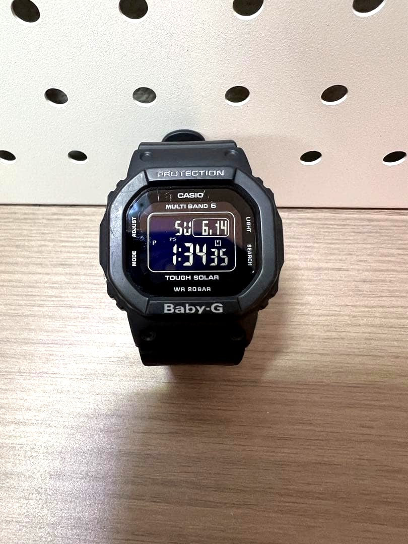 Casio Baby-G black digital watch with Tough Solar and Multi-Band 6 features showing shock resistant design