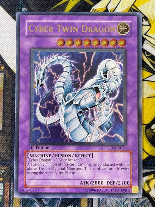 Yugioh Cyber Twin Dragon English Relief 1st Edition card showing some wear with chipping and scratches