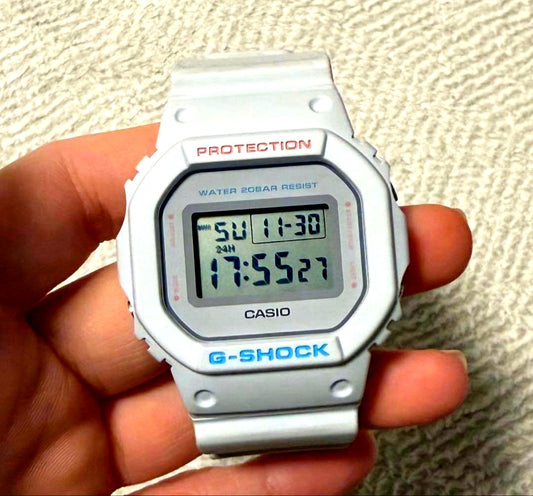 Casio G-Shock DW-5600SC white digital watch with water lock resistance and minor scratches on the band