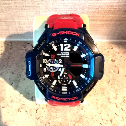 Casio G-Shock digital watch with blue and red resin band and digital display
