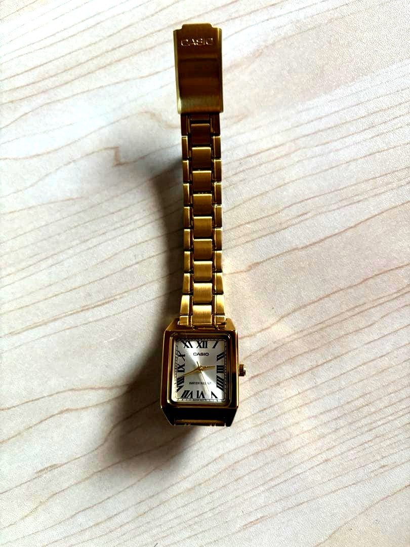 Gold Casio LTP-V007G-9B wristwatch with adjusted links and included removed links