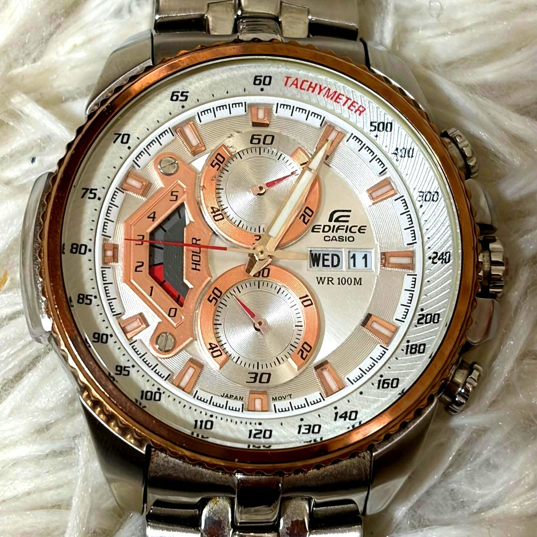 Casio Edifice EF-558D-7AV analog watch with silver band, black dial, and stopwatch function in box