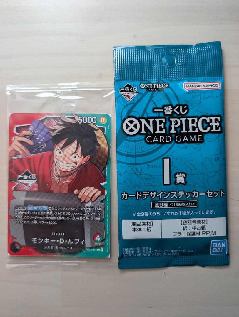 One Piece Monkey D Luffy promotional card and sticker set featuring award card design
