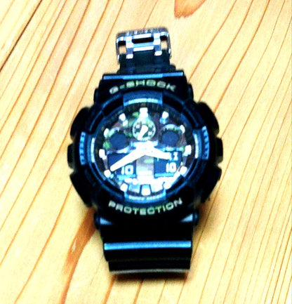 Casio G-Shock GA-100CF camouflage resin watch with digital analog display and resin band