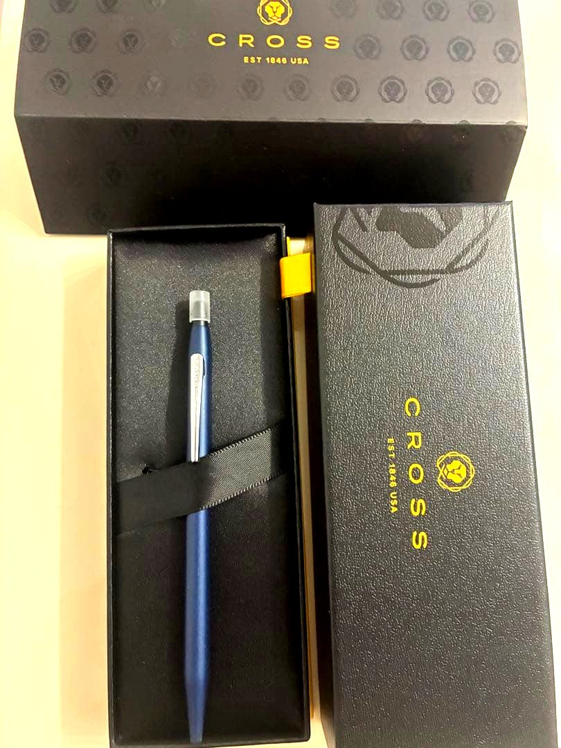 Cross blue ballpoint pen with matte finish and silver clip displayed with special case