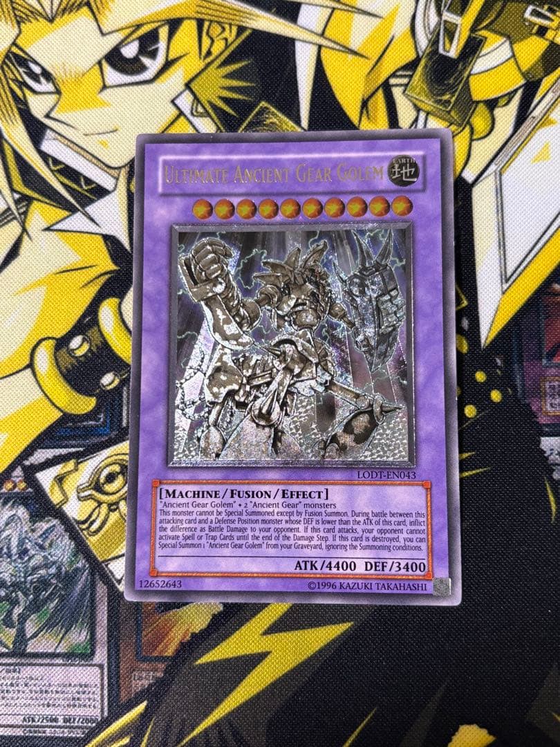 Yu-Gi-Oh Ancient Mechanical Ultimate Giant English Unlimited card showing front artwork with minor scratches and chips