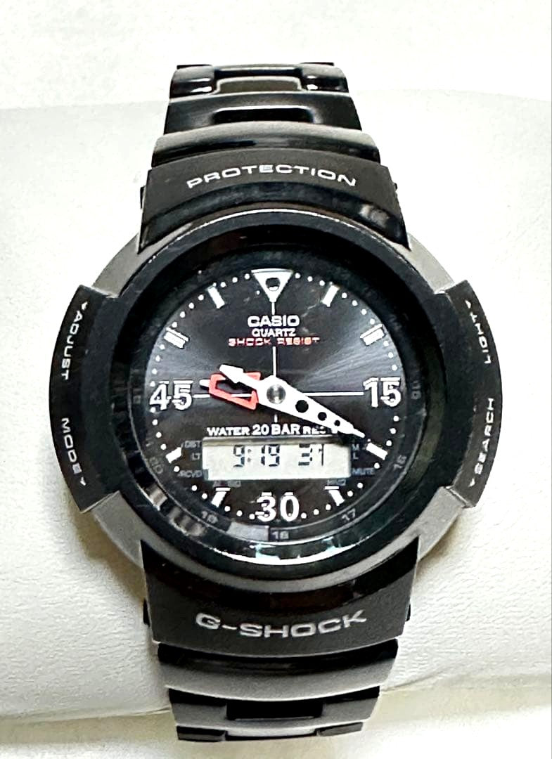 Casio G-Shock AWM-500-1AJF watch body with black dial and band, featuring solar charging and 20 ATM water resistance