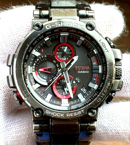 Casio G-Shock MTG-B1000B-1AJF Radio Solar Black watch with black IP finish, rubber strap, and original box