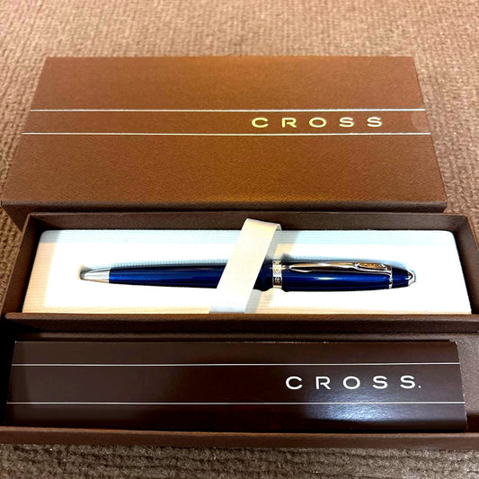 Cross Blue metal ballpoint pen with twist design and dedicated case on white background