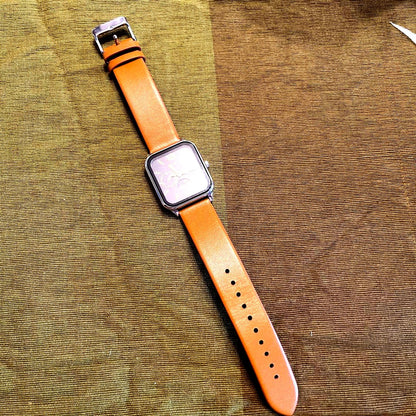 Casio MTP-M305L-1A rectangle watch with black dial, gold hands, and brown leather strap