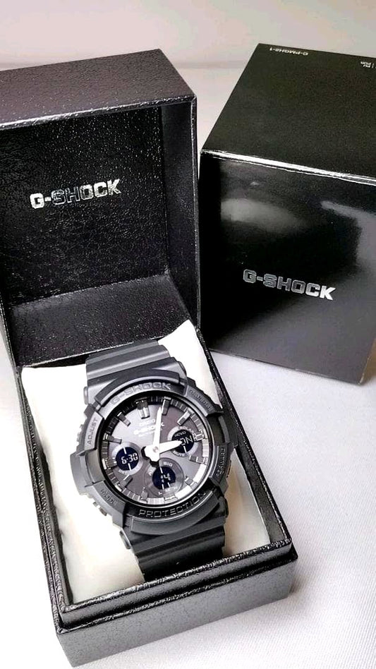 Casio G-Shock GAW-100B-1AJF black resin watch with digital analog display and aluminum bezel