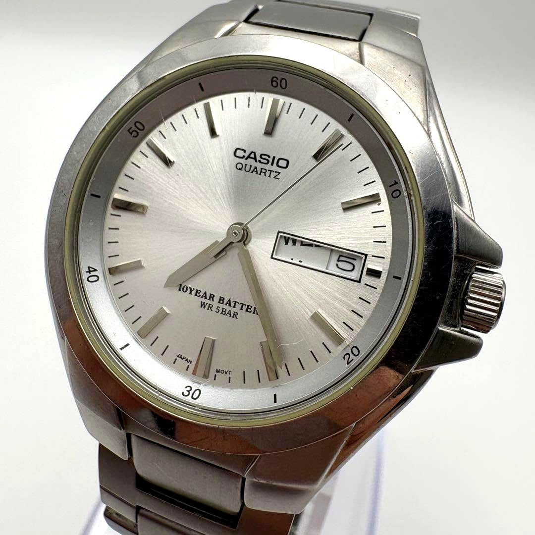 Casio MTP-1228DJ vintage mens silver stainless steel wristwatch with day and date display