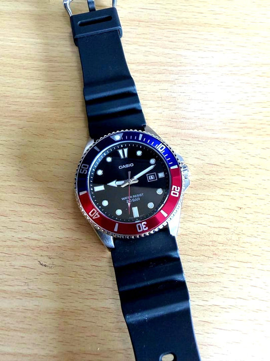 Casio MDV-107-1A3JF used diver's watch with black dial and metal strap showing minor scratches